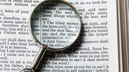 magnifying glass on a book.