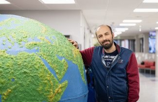 Man with a giant globe
