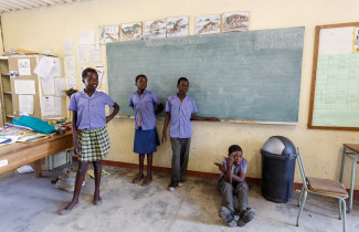 Namibian schoolchildren wait for class to begin in the classroom.