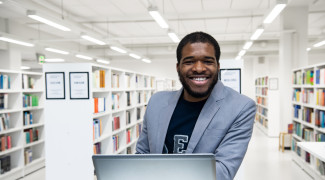 Promo picture of a Master&#039;s student in a library