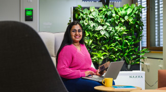 Student typing on laptop