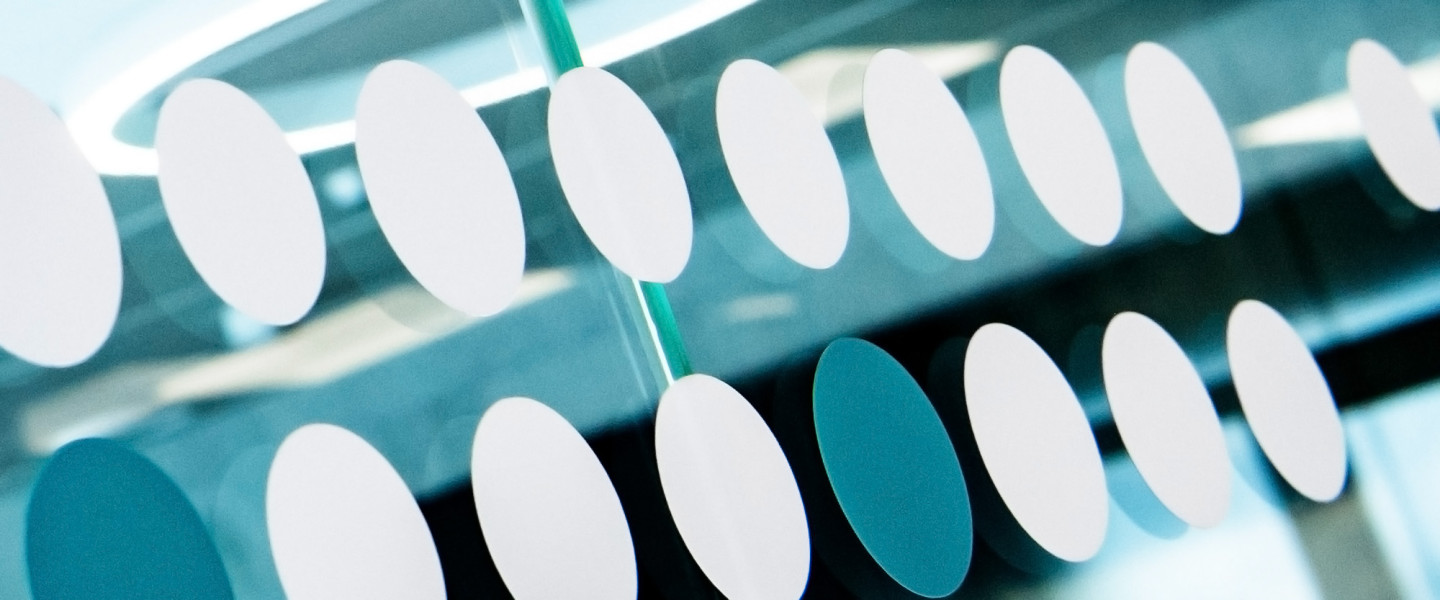 Round stickers on glass wall.