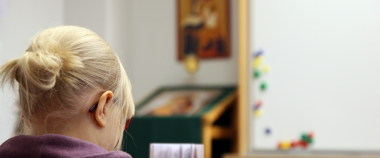 Girl is reading Bible.