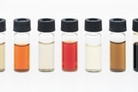 Photo of bio-based chemicals in small glass bottles.