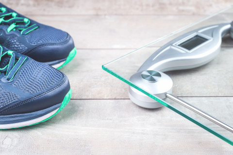 Running shoes and a digital scale