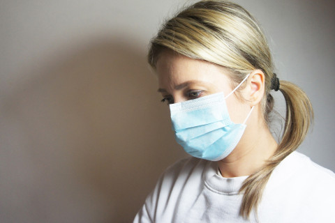 Woman with surgical face mask