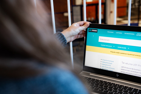Woman working on a computer.