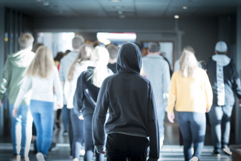 Teenagers in school corridor