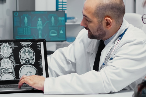 Doctor explaining brain scan results to a patient.