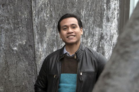 Student standing outside and smiling