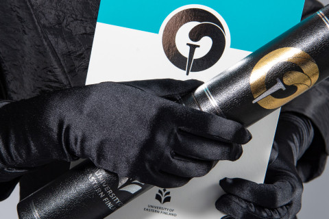 Doctors&#039; conferment ceremony book and doctor&#039;s diploma tube.