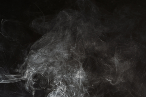 Gray smoke on black background.