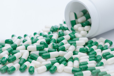 Green and white capsule pills.