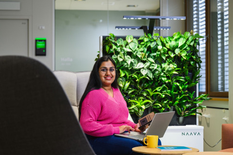 Student typing on laptop