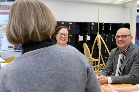 Staff sitting around the table. 