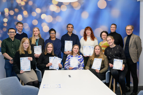 Grant recipients in a group photo with representatives of the Kuopio University Foundation.