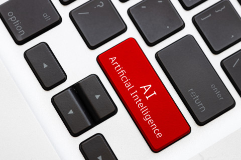 Punainen AI-näppäin tietokoneen näppäimistöllä.