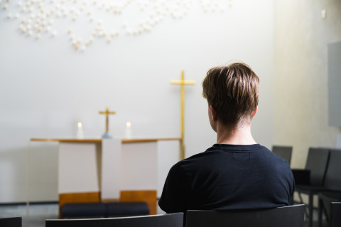 Young man in the chapel.