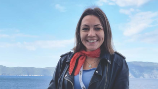 Student smiling, mountains on the background_YUFE