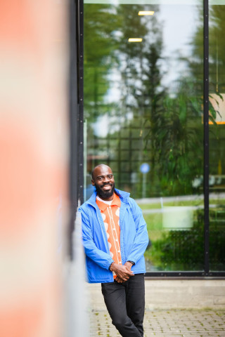 Student standing outside and smiling