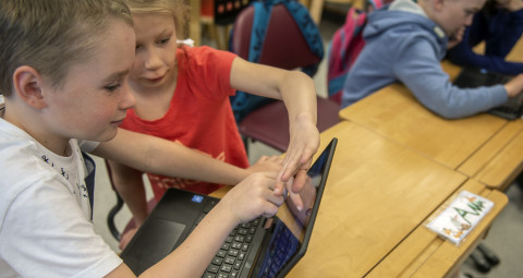 Pupils with computer.