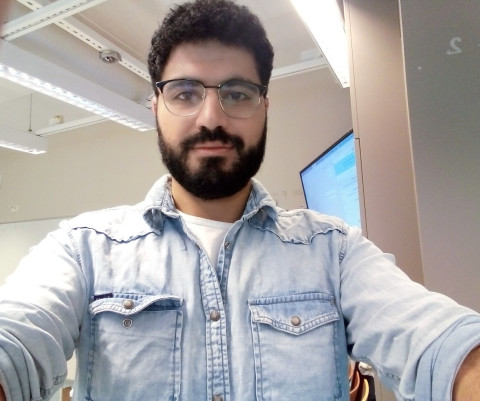 Selfie of a male student with a beard and glasses