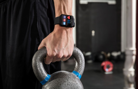 Man holding a kettle bell.