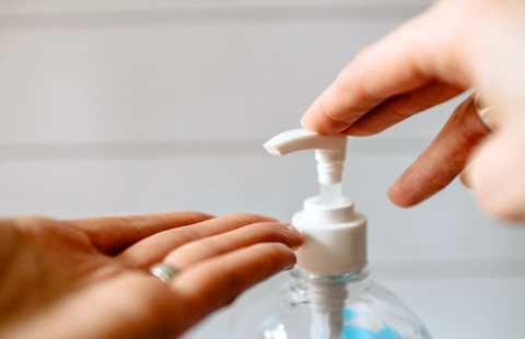 Disinfecting hands with hand sanitizer