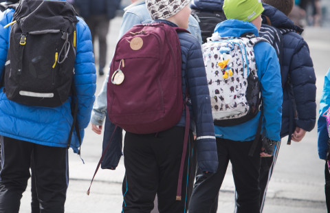 Childern with the backpacks.