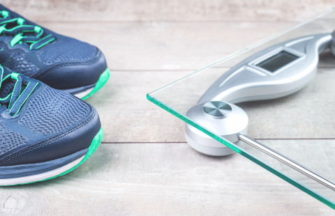 Running shoes and a digital scale