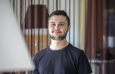 Young man looking at the camera smiling