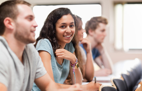Smiling student on a lecture.