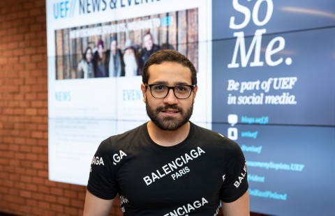 Young man with glasses looking straight to the camera.