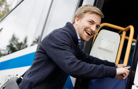 Man boarding a bus.