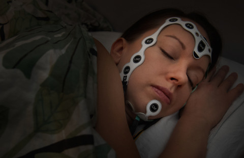 Sensors fixed on a sleeping womans head.