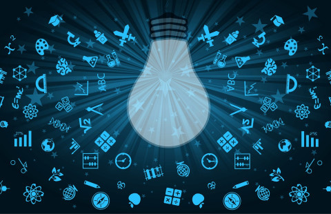 piirrokuvassa kymmeniä erilaisia symboleita hehkulampun ympärillä