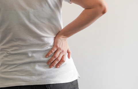 Close-up of a person with lower back pain