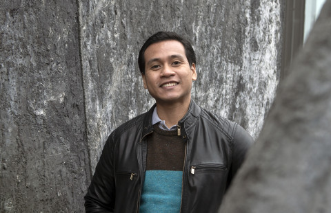 Student standing outside and smiling