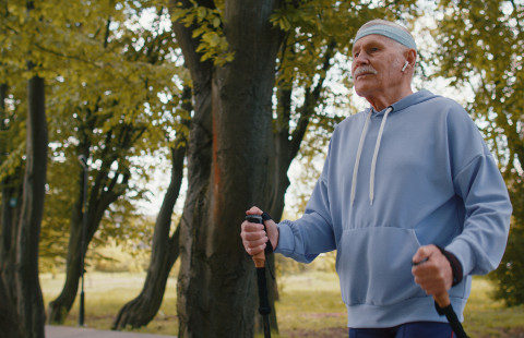 Senior man practicing Nordic walking.
