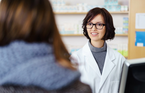 Pharmacist with a customer.