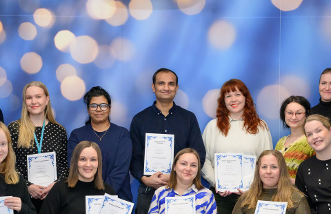 Grant recipients in a group photo with representatives of the Kuopio University Foundation.