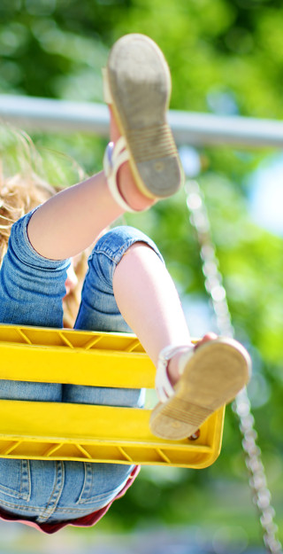 Child swinging on a playground