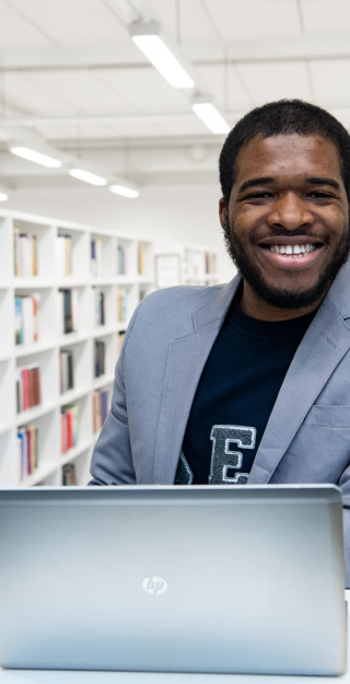 Promo picture of a Master's student in a library